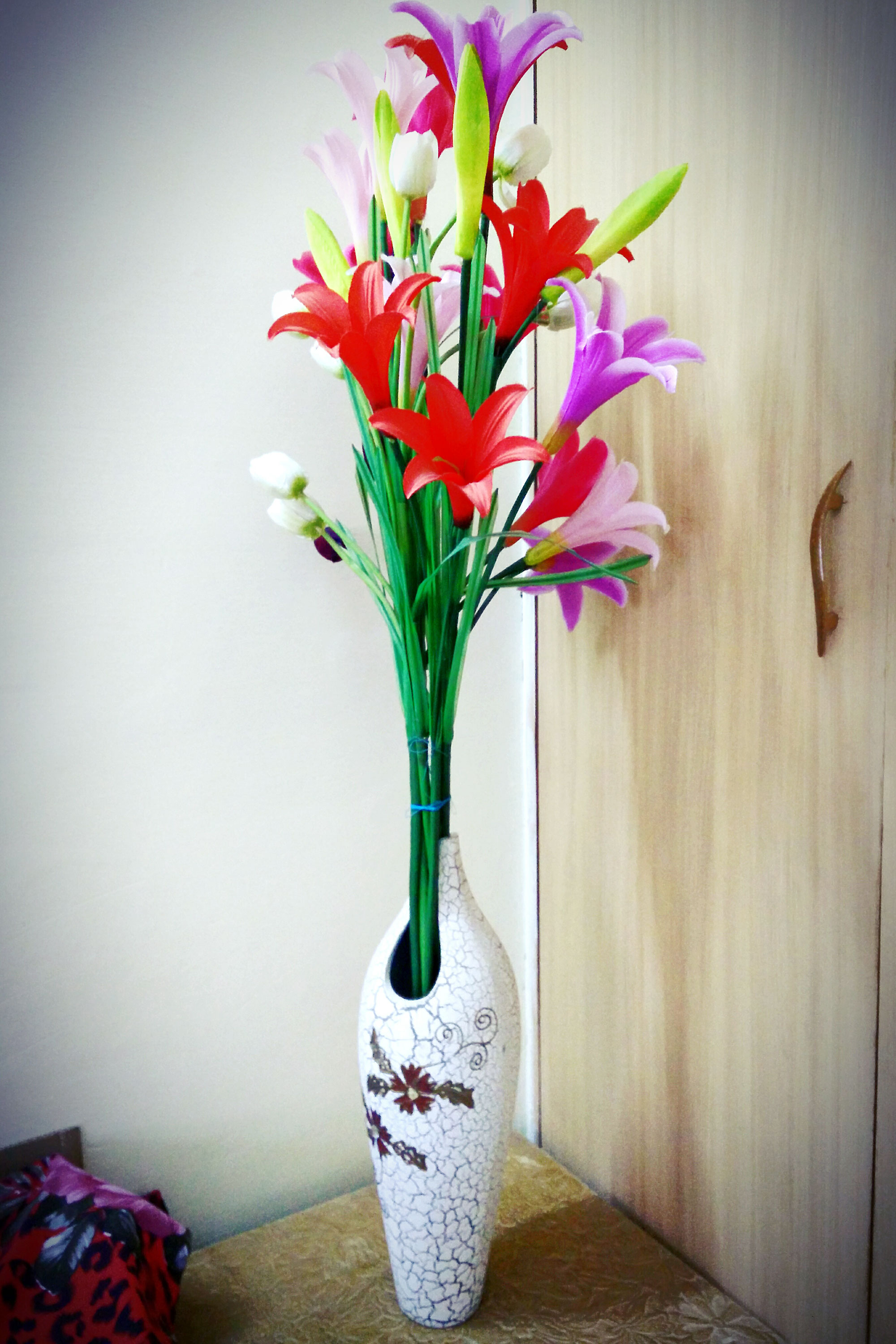 Tall flower vase with artificial flowers